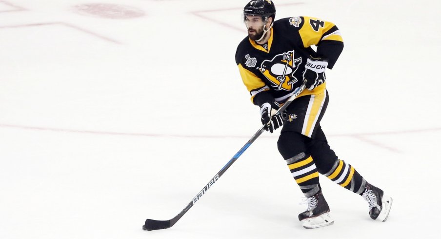 Justin Schultz skates the puck up the ice during the Stanley Cup Final.