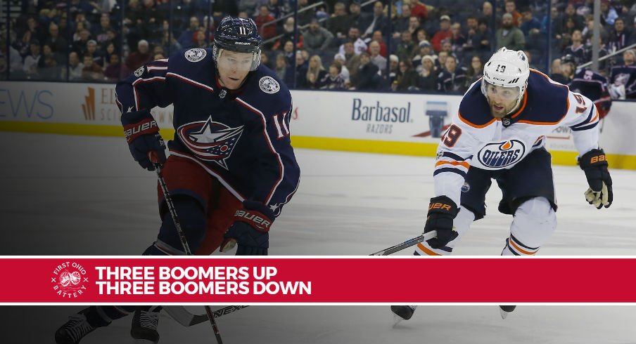 Matt Calvert tries to skate away from Oilers forward Patrick Maroon