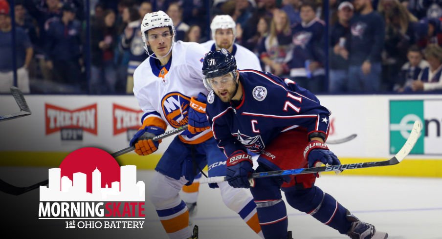 Nick Foligno tries to skate past Matthew Barzal