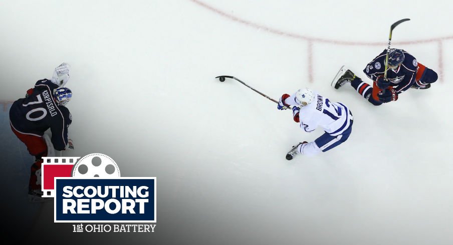 Seth Jones defends against Maple Leafs forward Connor Brown