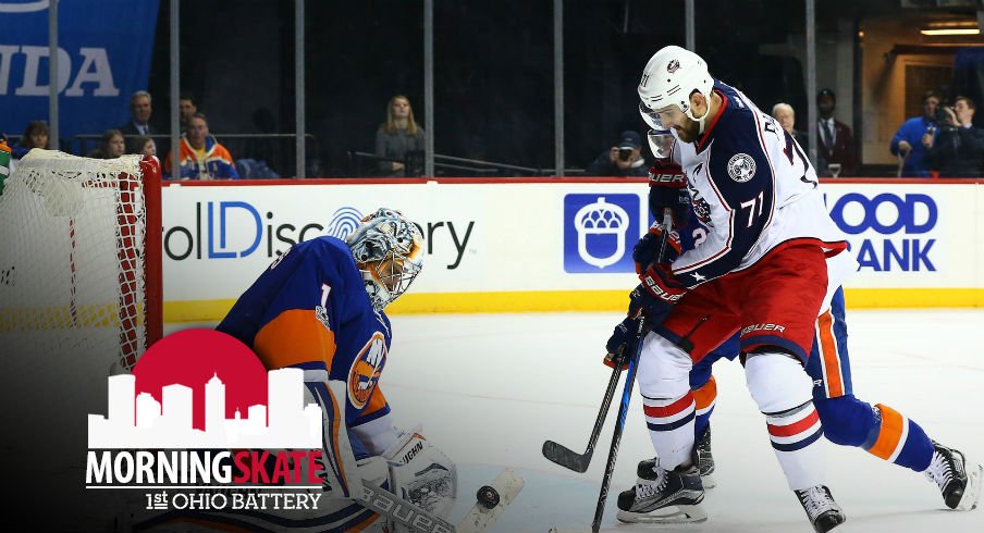 Nick Foligno tries to sneak the puck past Thomas Greiss