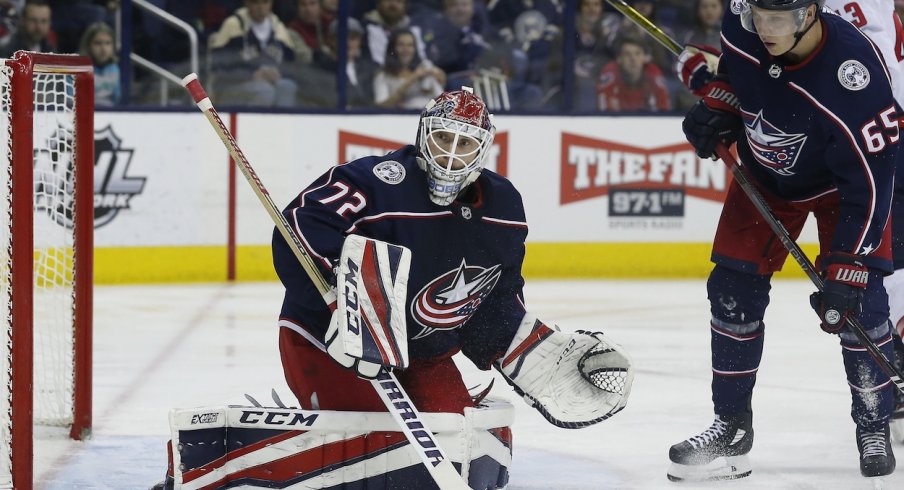 Sergei Bobrovsky pushes a puck towards the boards against the Washington Capitals