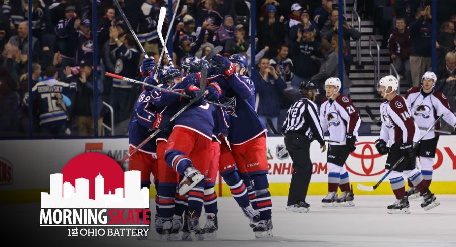 The Blue Jackets celebrate after scoring a goal against the Colorado Avalanche