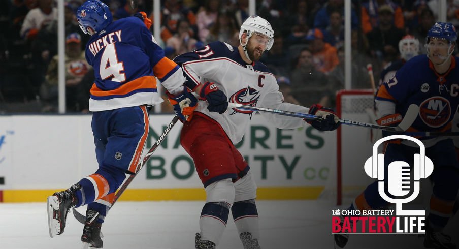 Thomas Hickey reacts to a hit from Blue Jackets forward Nick Foligno