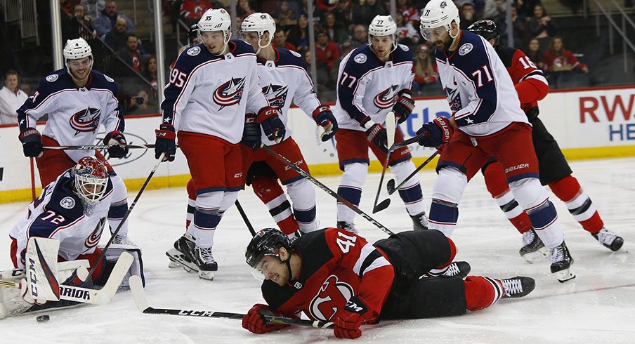 Five Blue Jackets watch man collapsed on ice.