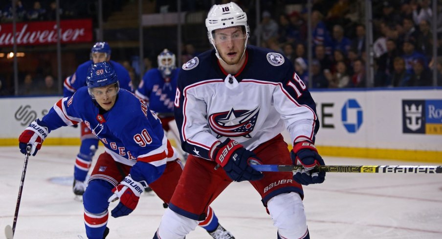 Pierre-Luc Dubois fights for a puck against the New York Rangers