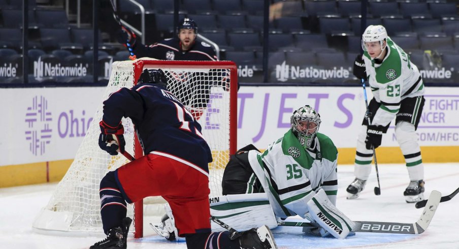 Feb 4, 2021; Columbus, Ohio, USA; Dallas Stars goaltender Anton Khudobin (35) reacts as Columbus Blue Jackets right wing Cam Atkinson (13) scores a goal in the third period at Nationwide Arena.