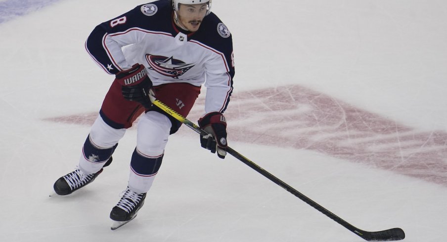 Columbus Blue Jackets defenseman Zach Werenski (8) skates on the ice for being named a star of the game, after scoring the game winning goal against the St. Louis Blues in the overtime period at Nationwide Arena. 