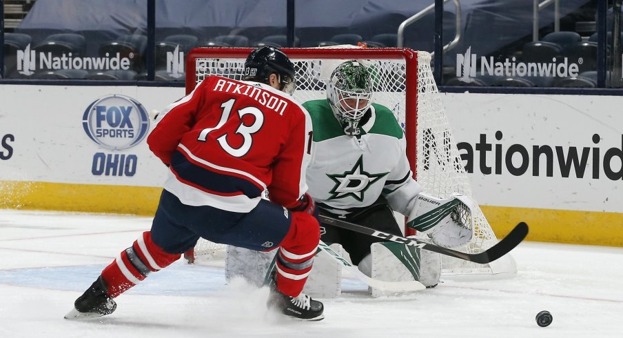 Cam Atkinson looks to bury the puck.