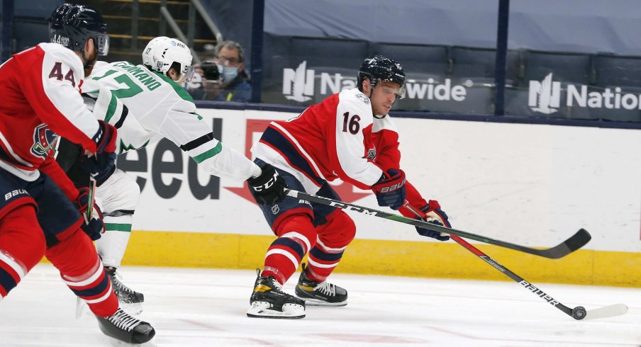 Feb 2, 2021; Columbus, Ohio, USA; Columbus Blue Jackets center Max Domi (16) carries the puck past Dallas Stars right wing Nick Caamano (17) during the third period at Nationwide Arena.