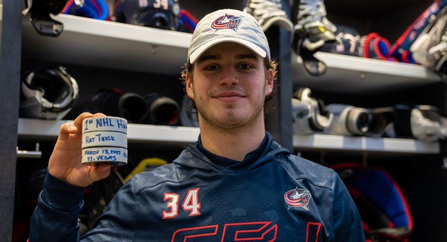 Cole Sillinger celebrates his first career hat trick