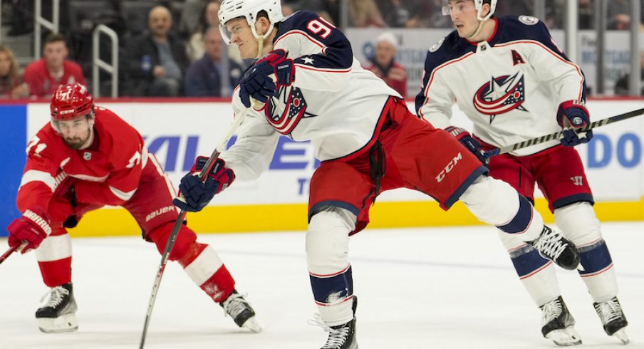 Columbus Blue Jackets' Jack Roslovic shoots and scores against the Detroit Red Wings at Little Caesars Arena.