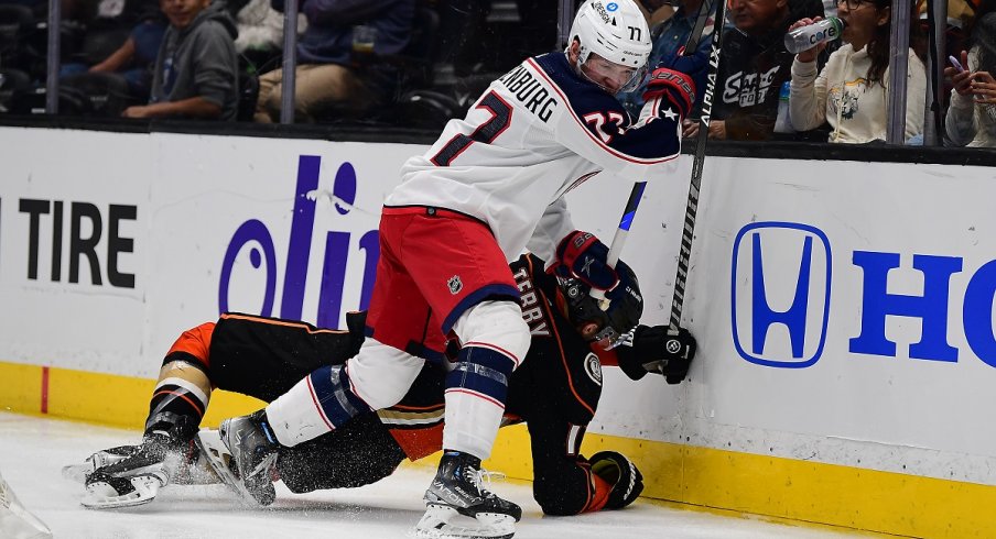 Nick Blankenburg hits Troy Terry during the second period at Honda Center