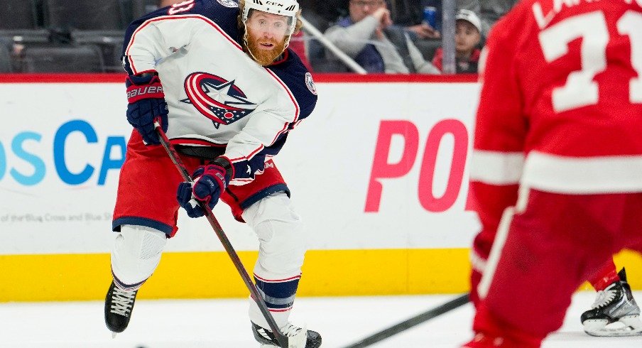 Columbus Blue Jackets right wing Jakub Voracek skates with the puck toward Detroit Red Wings center Dylan Larkin during the first period at Little Caesars Arena.