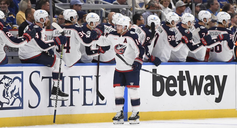 Columbus Blue Jackets' Gustav Nyquist is congratulated by teammates after scoring a goal against the St. Louis Blues during the second period at Enterprise Center.