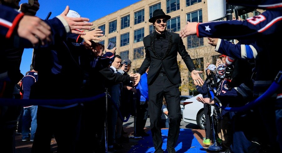 Columbus Blue Jackets goaltender Elvis Merzlikins high-fives fans as he walks the Blue Carpet prior to the game against the Tampa Bay Lightning at Nationwide Arena.