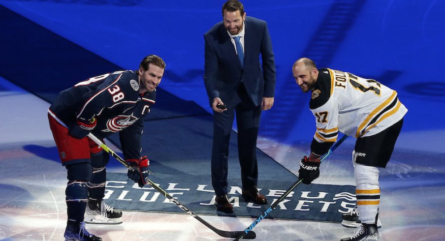 Former Columbus Blue Jackets' Rick Nash drops the ceremonial puck with Columbus Blue Jackets' Boone Jenner and Boston Bruins' Nick Foligno before the start of the first period at Nationwide Arena.