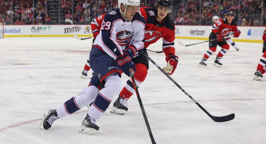 Patrik Laine skates with the puck against the New Jersey Devils