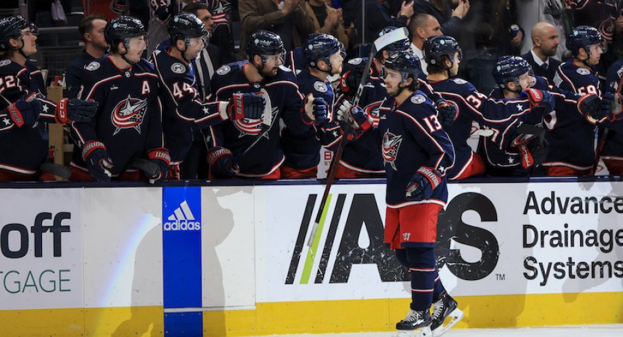 Columbus Blue Jackets' Johnny Gaudreau celebrates with teammates on the bench after scoring a goal against the Nashville Predators in the third period at Nationwide Arena.