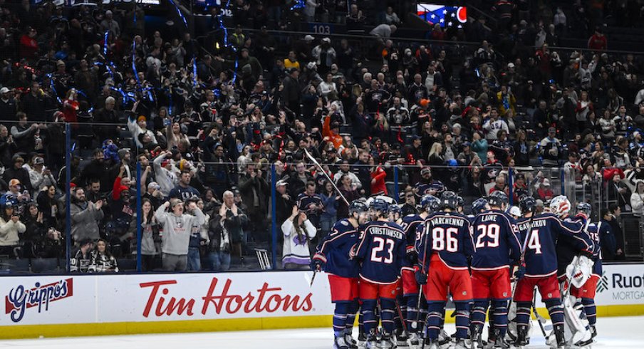 The Columbus Blue Jackets celebrate their overtime win over the Los Angeles Kings at Nationwide Arena.