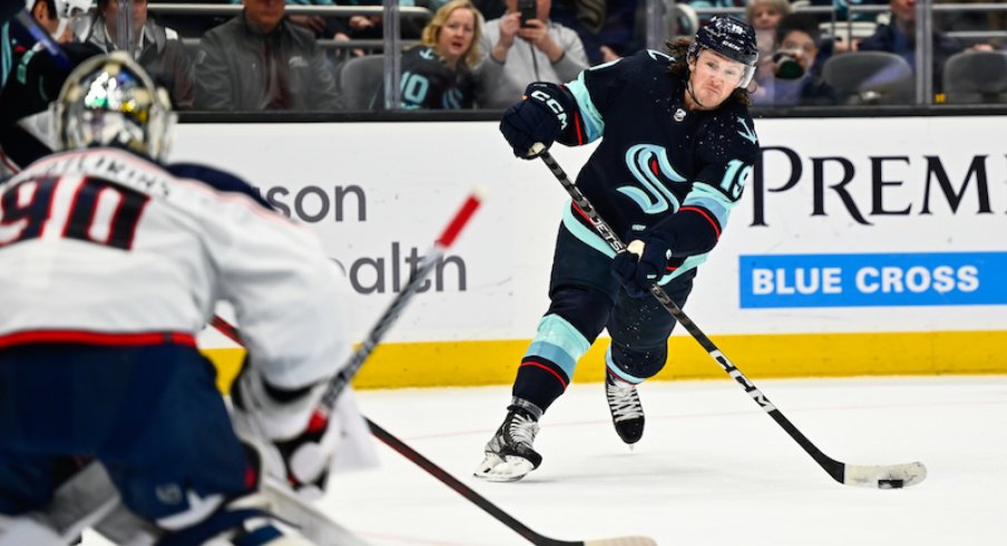 Seattle Kraken' Jared McCann shoots the puck against the Columbus Blue Jackets during the first period at Climate Pledge Arena.