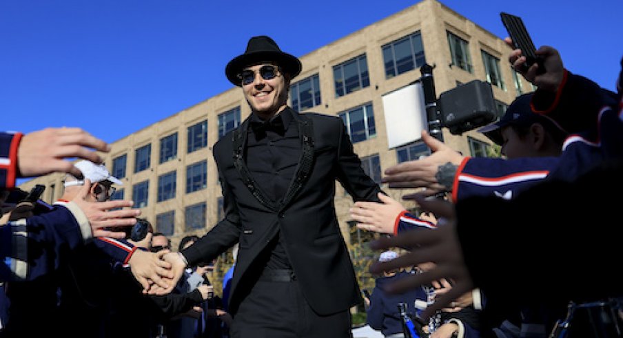 Columbus Blue Jackets goaltender Elvis Merzlikins (90) high-fives fans as he walks the Blue Carpet prior to the game against the Tampa Bay Lightning at Nationwide Arena.