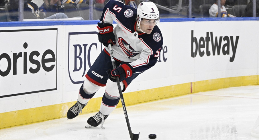 Columbus Blue Jackets defenseman Denton Mateychuk skates against the St. Louis Blues in preseason action