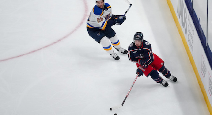 Columbus Blue Jackets left wing Johnny Gaudreau (13) skates with the puck against St. Louis Blues left wing Nathan Walker (26) in the first period at Nationwide Arena.