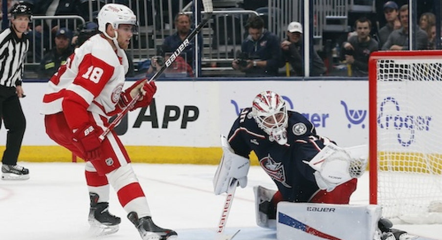 Columbus Blue Jackets goalie Spencer Martin (30) makes a glove save on the penalty shot attempt of Detroit Red Wings center Andrew Copp (18) during the third period at Nationwide Arena.