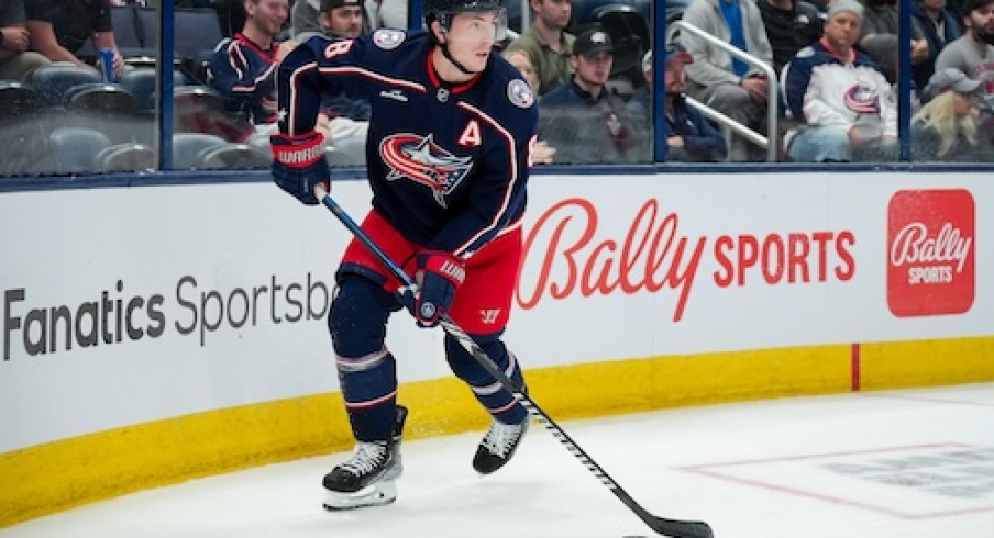 Columbus Blue Jackets defenseman Zach Werenski (8) skates with the puck against the Philadelphia Flyers in the second period at Nationwide Arena.