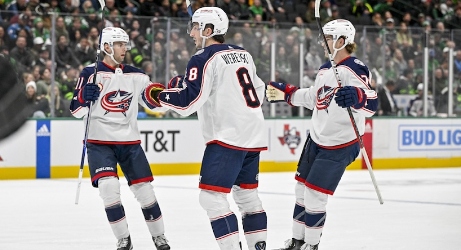 Columbus Blue Jackets' Adam Fantilli and Zach Werenski celebrates a goal Damon Severson scored against the Dallas Stars during the first period at the American Airlines Center.