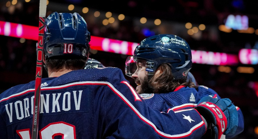 Columbus Blue Jackets left wing Kirill Marchenko (86) celebrates with teammates after scoring a goal against the Tampa Bay Lightning in the first period at Nationwide Arena.