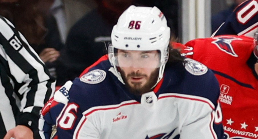 Columbus Blue Jackets left wing Kirill Marchenko (86) skates with the puck as Washington Capitals defenseman Nick Jensen (3) defends in the third period at Capital One Arena.