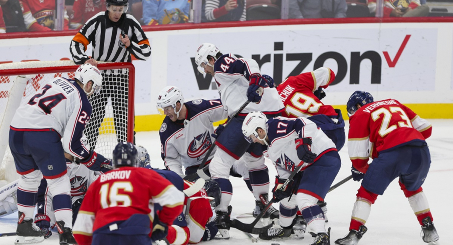 Florida Panthers center Carter Verhaeghe hunts for a loose puck