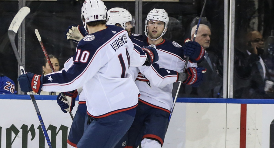 Adam Fantilli celebrates with his teammates after scoring in the second period against the New York Rangers