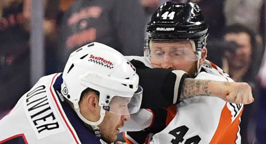 Columbus Blue Jackets right wing Mathieu Olivier (24) and Philadelphia Flyers left wing Nicolas Deslauriers (44) fight during the first period at Wells Fargo Center.