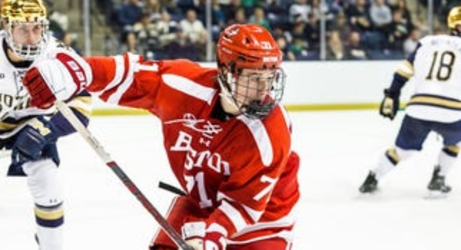 Boston University forward Macklin Celebrini (71) skates with the puck during the Boston University-Notre Dame NCAA hockey game on Saturday, October 21, 2023, at Compton Family Ice Arena in South Bend, Indiana.