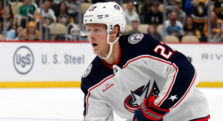 Columbus Blue Jackets defenseman Adam Boqvist (27) skates with the puck against the Pittsburgh Penguins in the shootout at PPG Paints Arena.