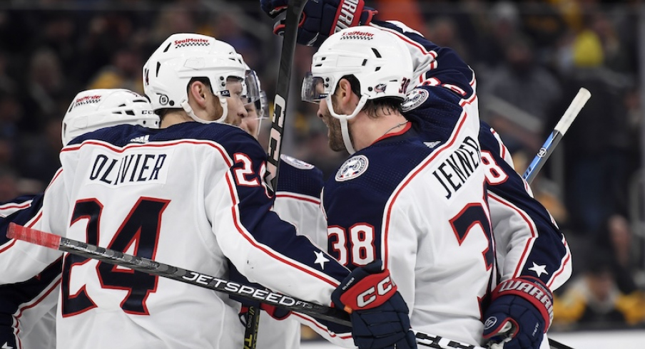 Columbus Blue Jackets' Boone Jenner celebrates his goal with Mathieu Olivier and the rest of his line mates during the second period against the Boston Bruins at TD Garden.