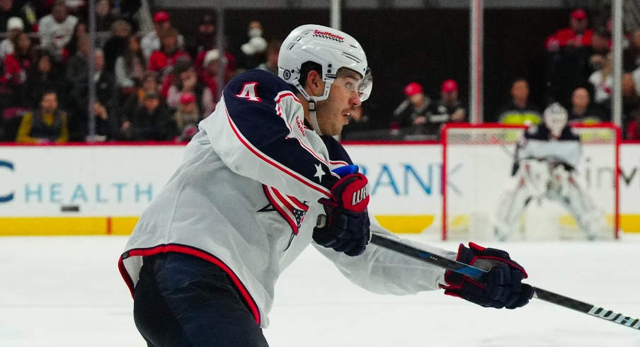 Columbus Blue Jackets center Cole Sillinger (4) watches his shot against the Carolina Hurricanes during the second period at PNC Arena.