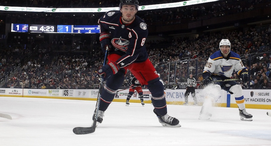 Columbus Blue Jackets' Zach Werenski tracks down a loose puck against the St. Louis Blues during the first period at Nationwide Arena.