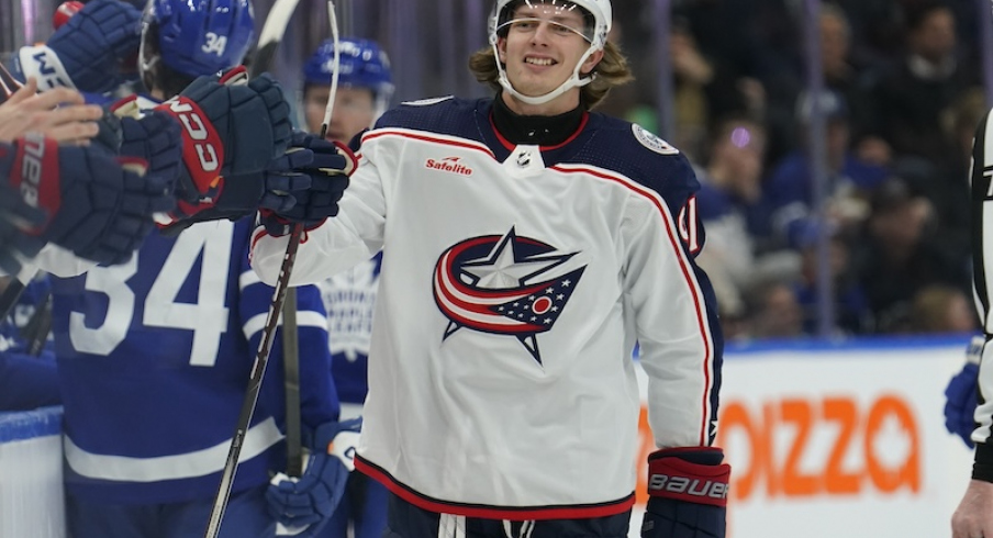 Columbus Blue Jackets' Kent Johnson gets congratulated after scoring against the Toronto Maple Leafs during the first period at Scotiabank Arena.