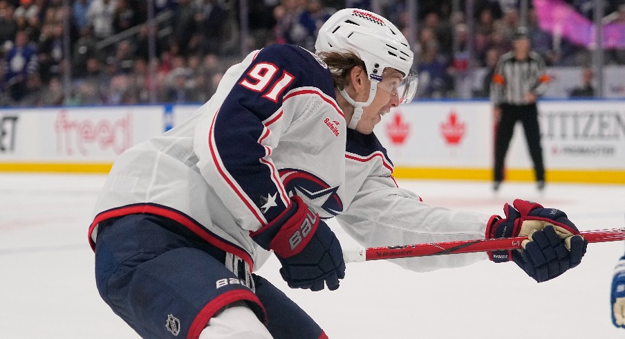 Columbus Blue Jackets forward Kent Johnson (91) scores the game winning goal against the Toronto Maple Leafs during the overtime at Scotiabank Arena.