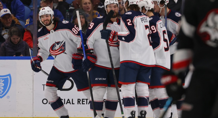 Columbus Blue Jackets' Kirill Marchenko celebrates his third goal of the game with teammates during the second period against the Buffalo Sabres at KeyBank Center.