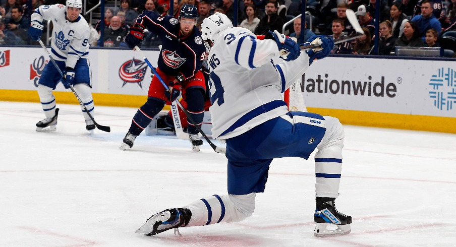 Toronto Maple Leafs center Auston Matthews (34) follows through on a slap shot for a goal against the Columbus Blue Jackets during the second period at Nationwide Arena.