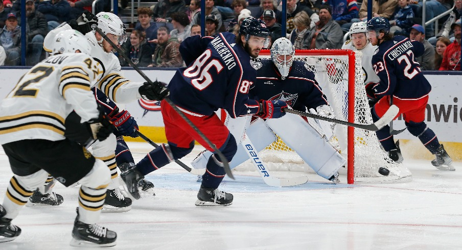 Columbus Blue Jackets right wing Kirill Marchenko (86) clears a rebound against the Boston Bruins during the second period at Nationwide Arena.