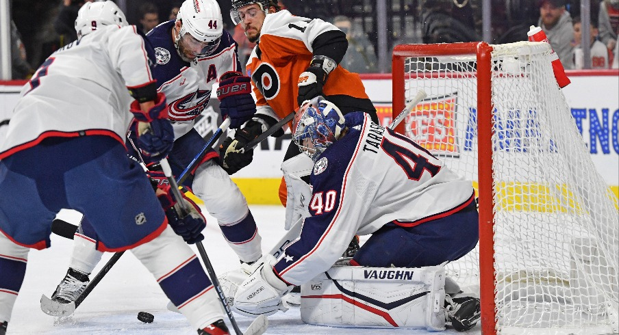 Columbus Blue Jackets defenseman Erik Gudbranson (44) and goaltender Daniil Tarasov (40) try to cover the puck against Philadelphia Flyers right wing Travis Konecny (11) during the first period at Wells Fargo Center.