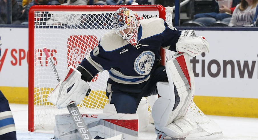 Columbus Blue Jackets' Elvis Merzlikins makes a blocker save against the Pittsburgh Penguins during the second period at Nationwide Arena.