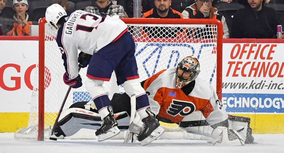 Columbus Blue Jackets left wing Johnny Gaudreau (13) scores a goal against Philadelphia Flyers goaltender Samuel Ersson (33) during the shootout at Wells Fargo Center.