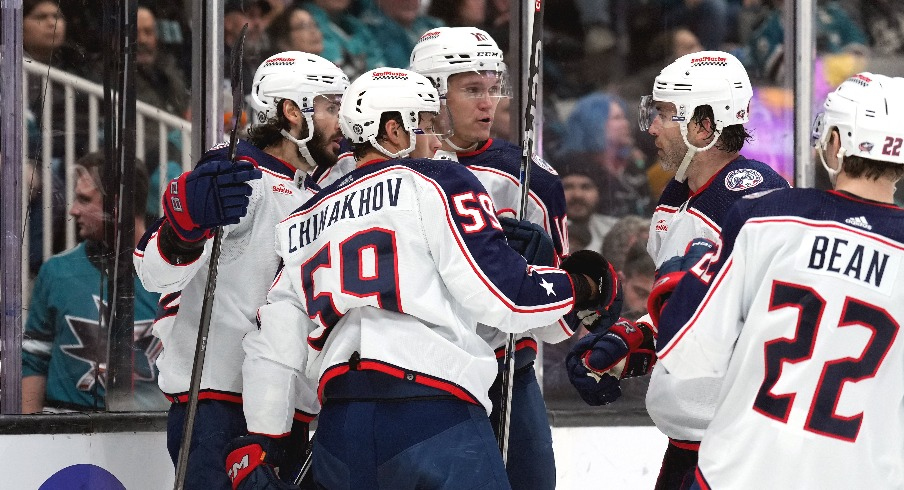 Columbus Blue Jackets right wing Kirill Marchenko (left) celebrates with teammates after scoring a goal against the San Jose Sharks during the first period at SAP Center at San Jose.